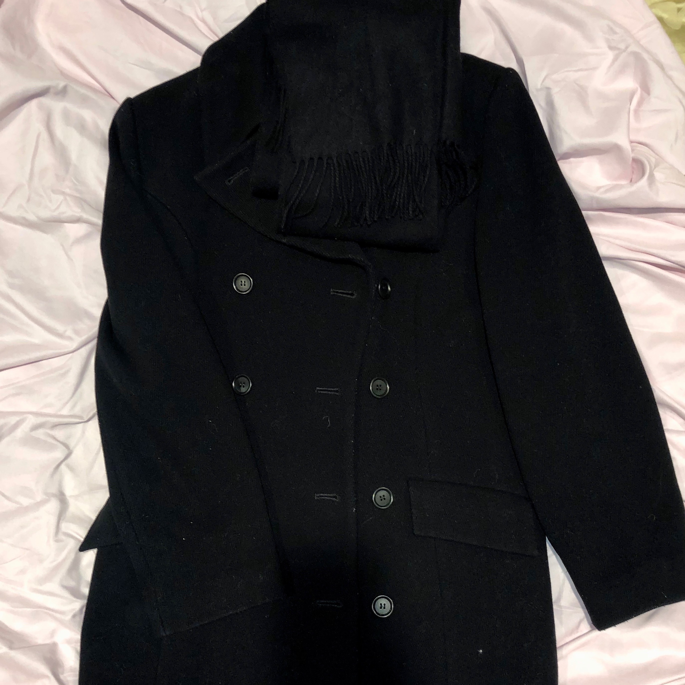 black coat on bed